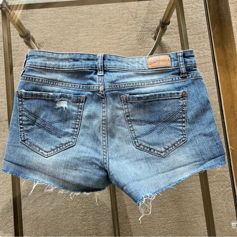 Distressed denim shorts.